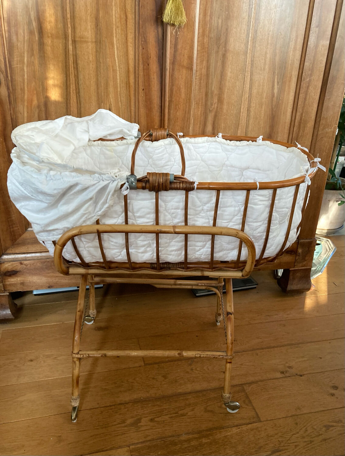 Bamboo, rattan, wicker cradle bassinet from the 1960s with a foldable support.
