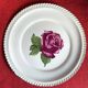 Decorative plate Harker with a red rose in the centre and a 22-carat gold border.