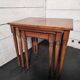 Nest of tables in solid cherry wood from the mid-20th century.