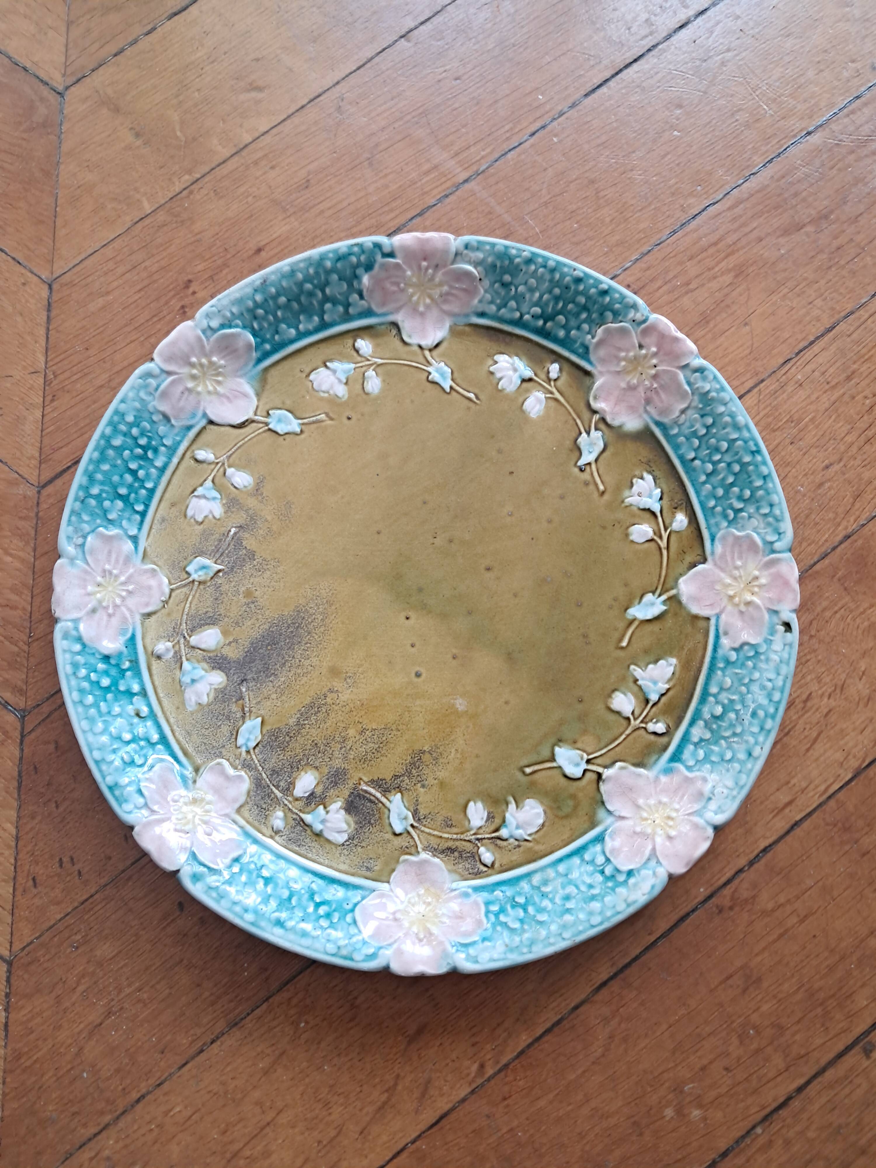 Vintage barbotine plate by Gustave de Bruyn.