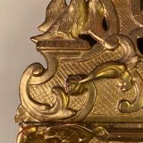 Miroir régence en bois sculpté doré début XVIIIème siècle