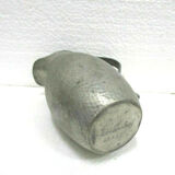 Art deco pitcher in hammered tin and signed E.H. Derbesy