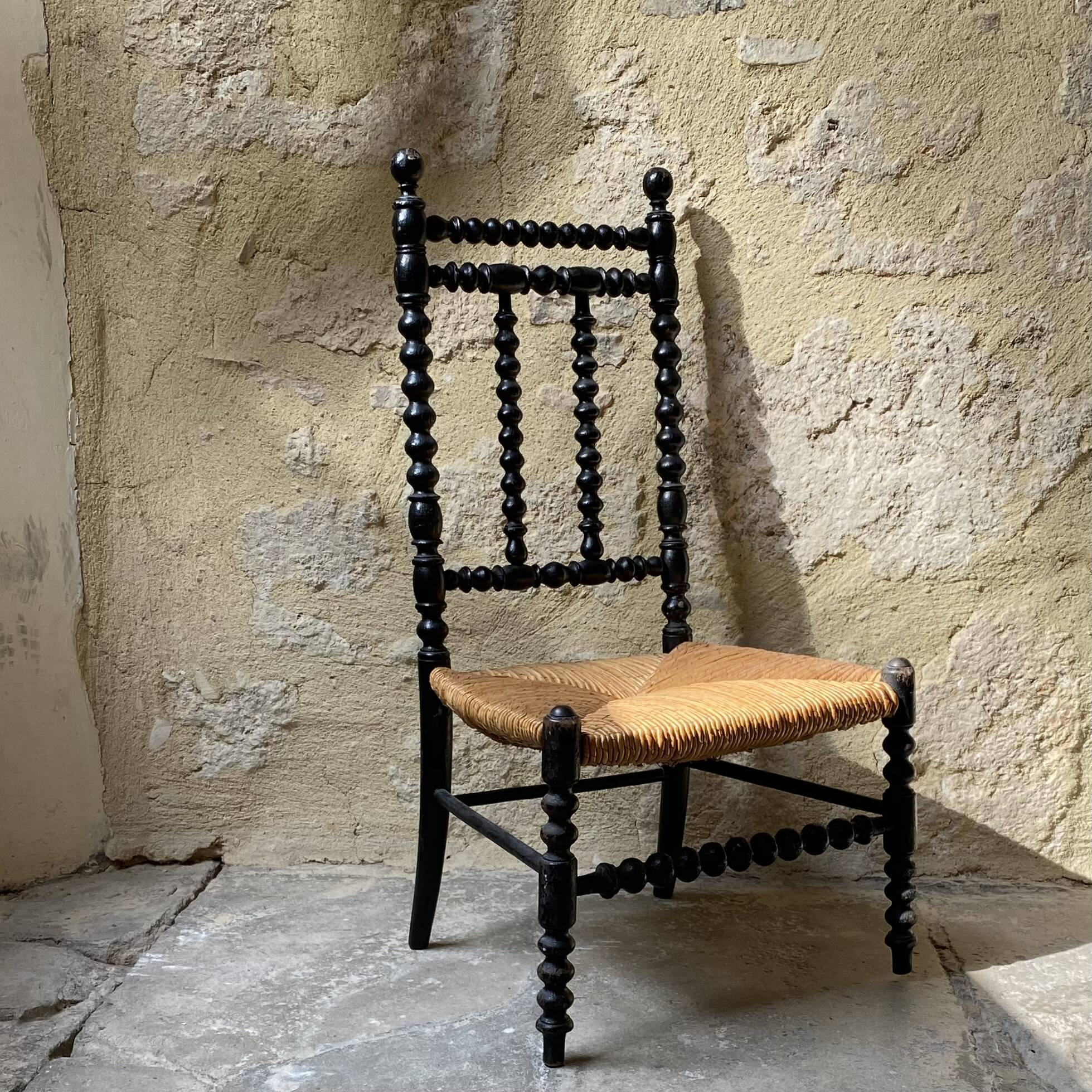 Low chair in turned wood