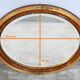 Miroir ovale en bois doré – début XXe