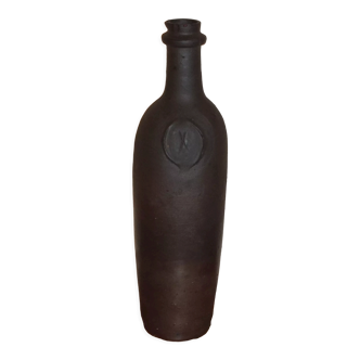 Old terracotta bottle with small spout