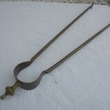 Old brass log clamp for fireplace