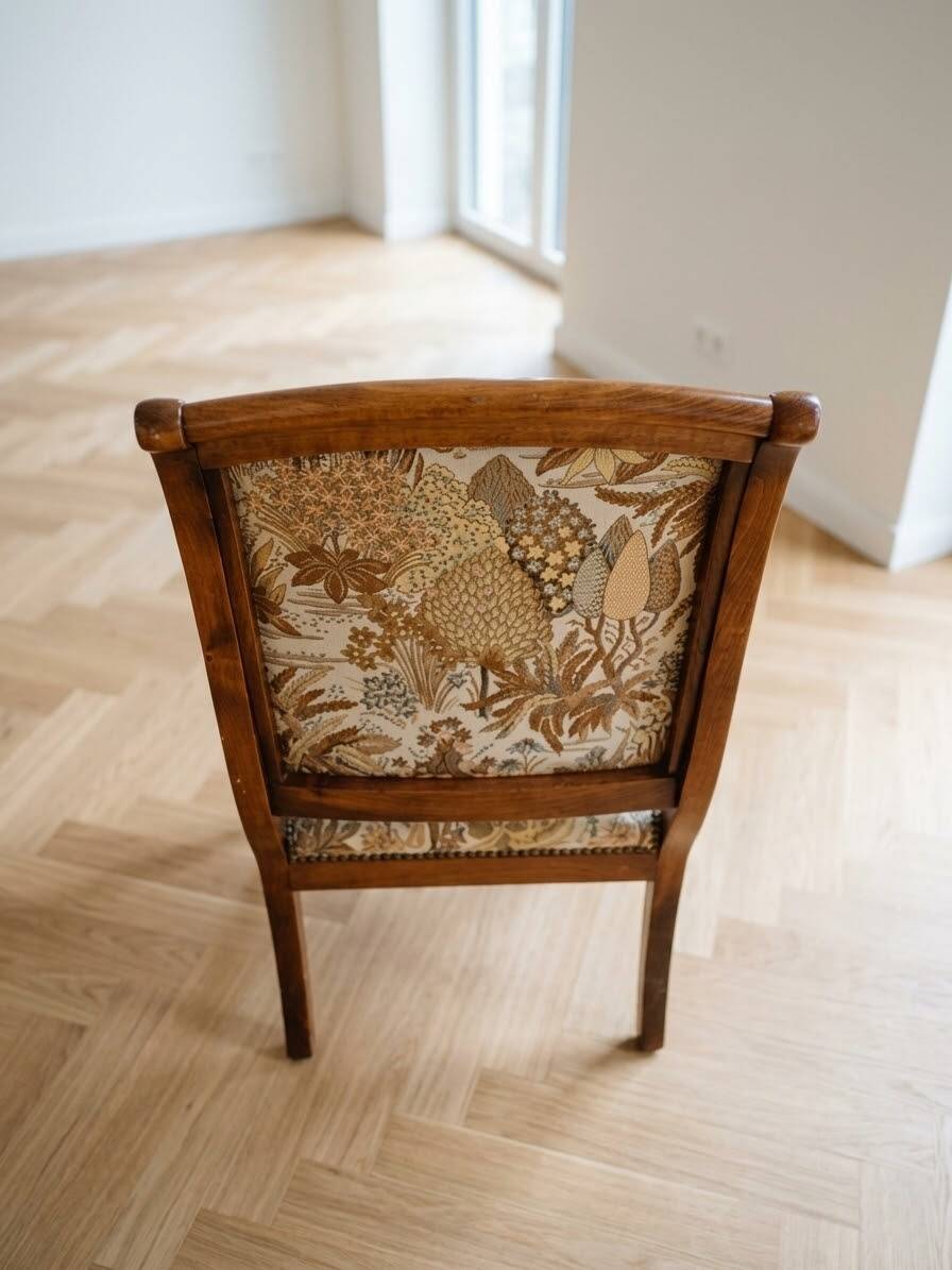 Old armchair with its stool