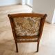 Old armchair with its stool