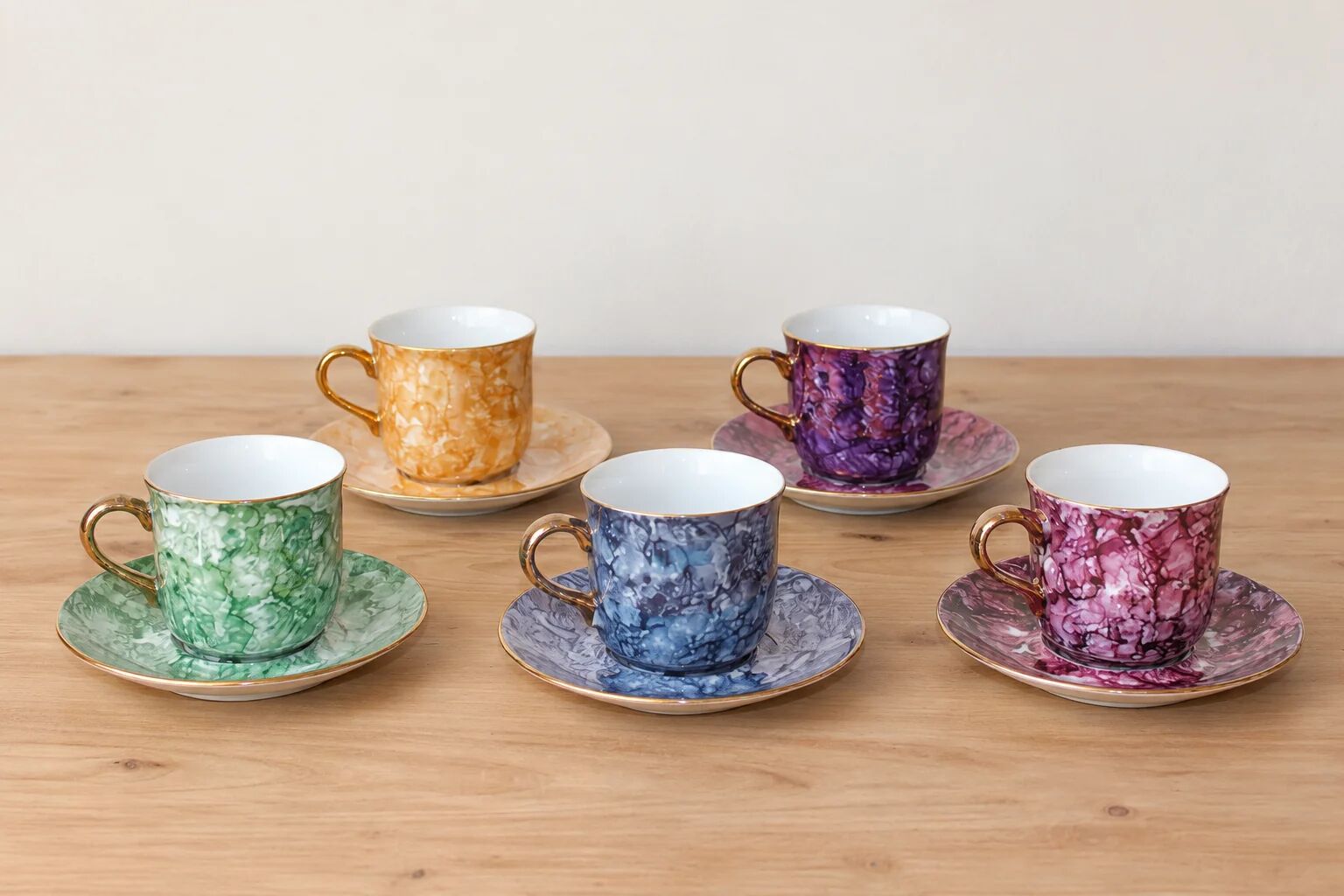 Set of 5 marbled porcelain coffee cups and saucers, hand-painted, with a gold rim.