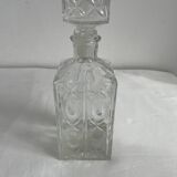 Molded glass carafe, 1960s-1970s, stylized flower decoration, oval, square base, stopper, rosette