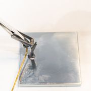 Table lamp of stainless steel and of italian design by Flos