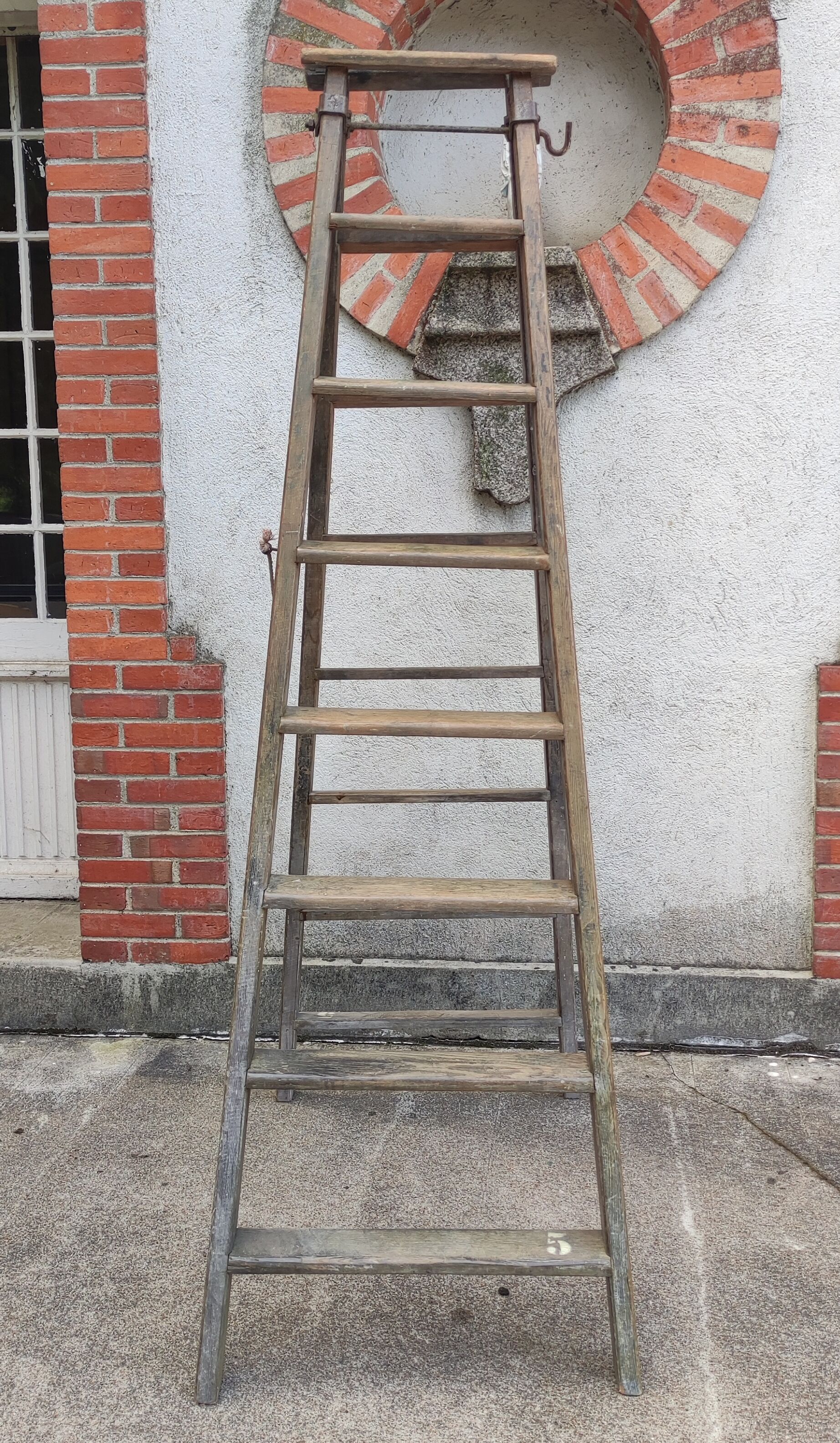 Old wooden stepladder stamped