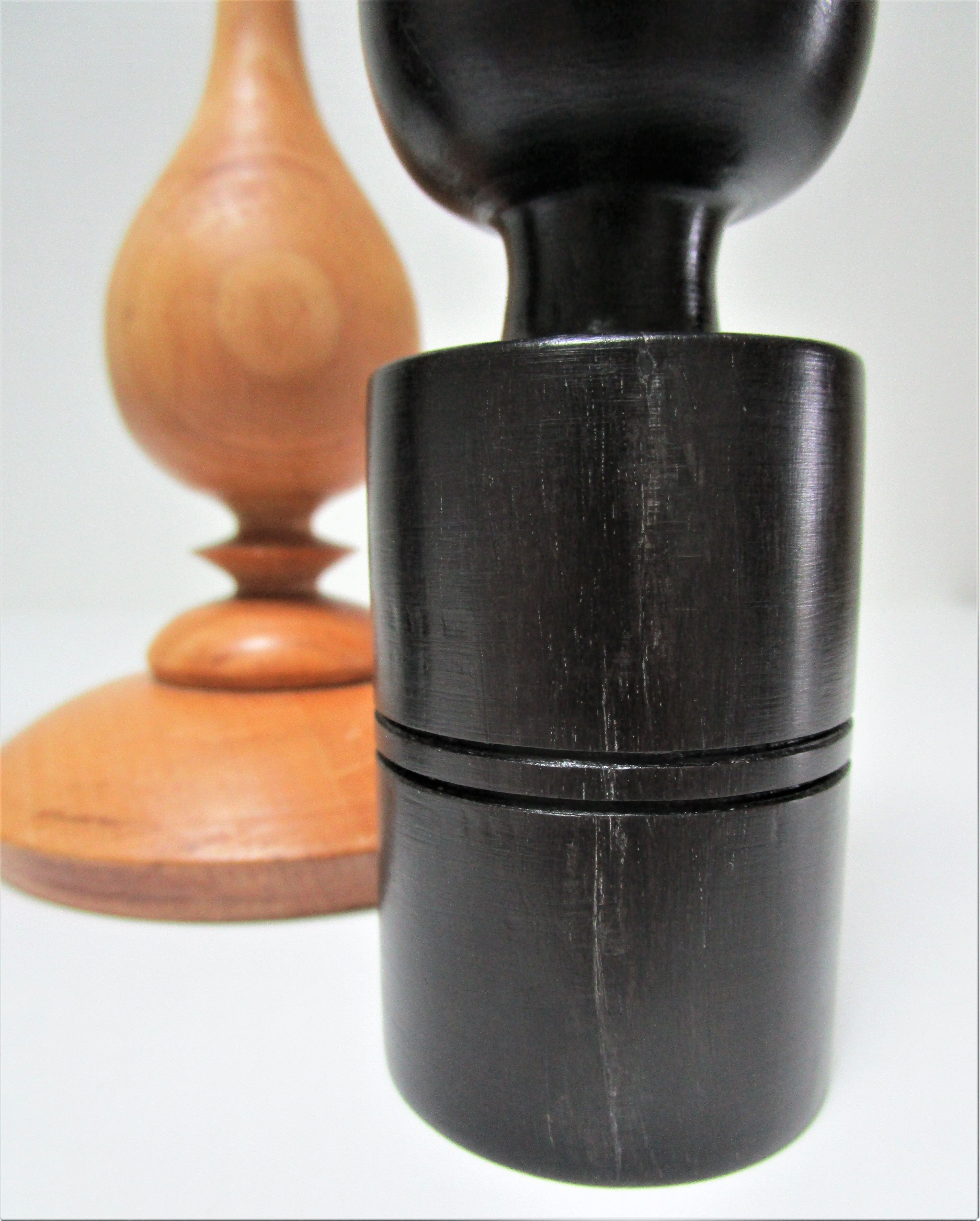 Three vintage light and dark wood candlesticks