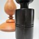 Three vintage light and dark wood candlesticks