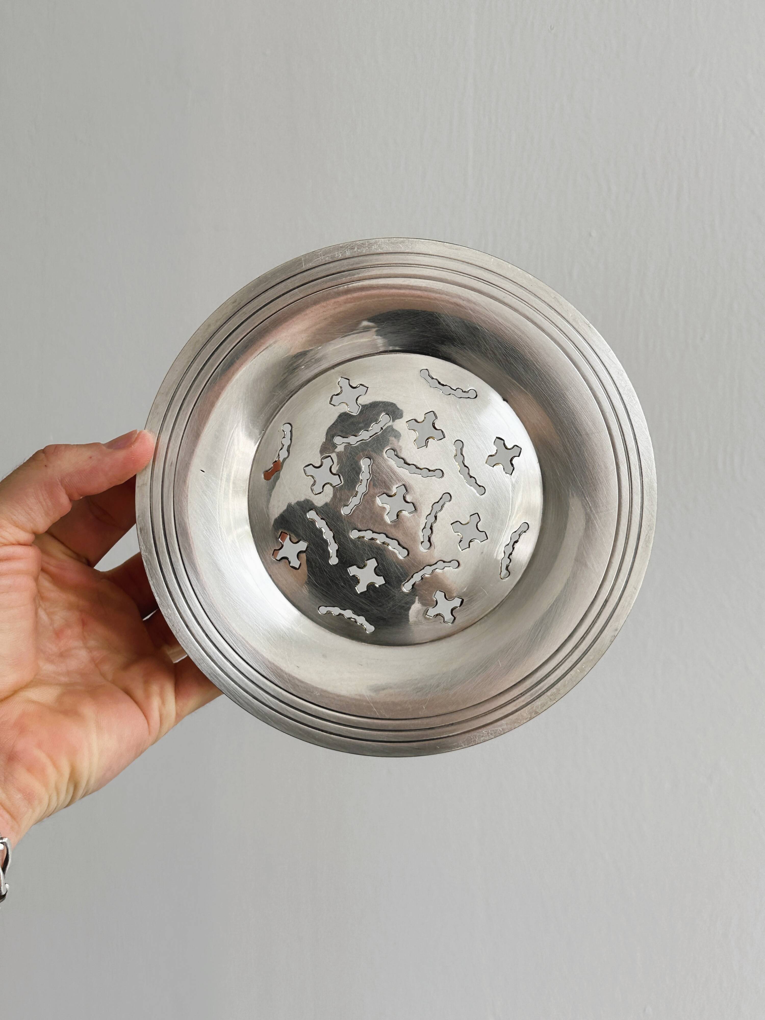 Antique butter dish in shiny metal