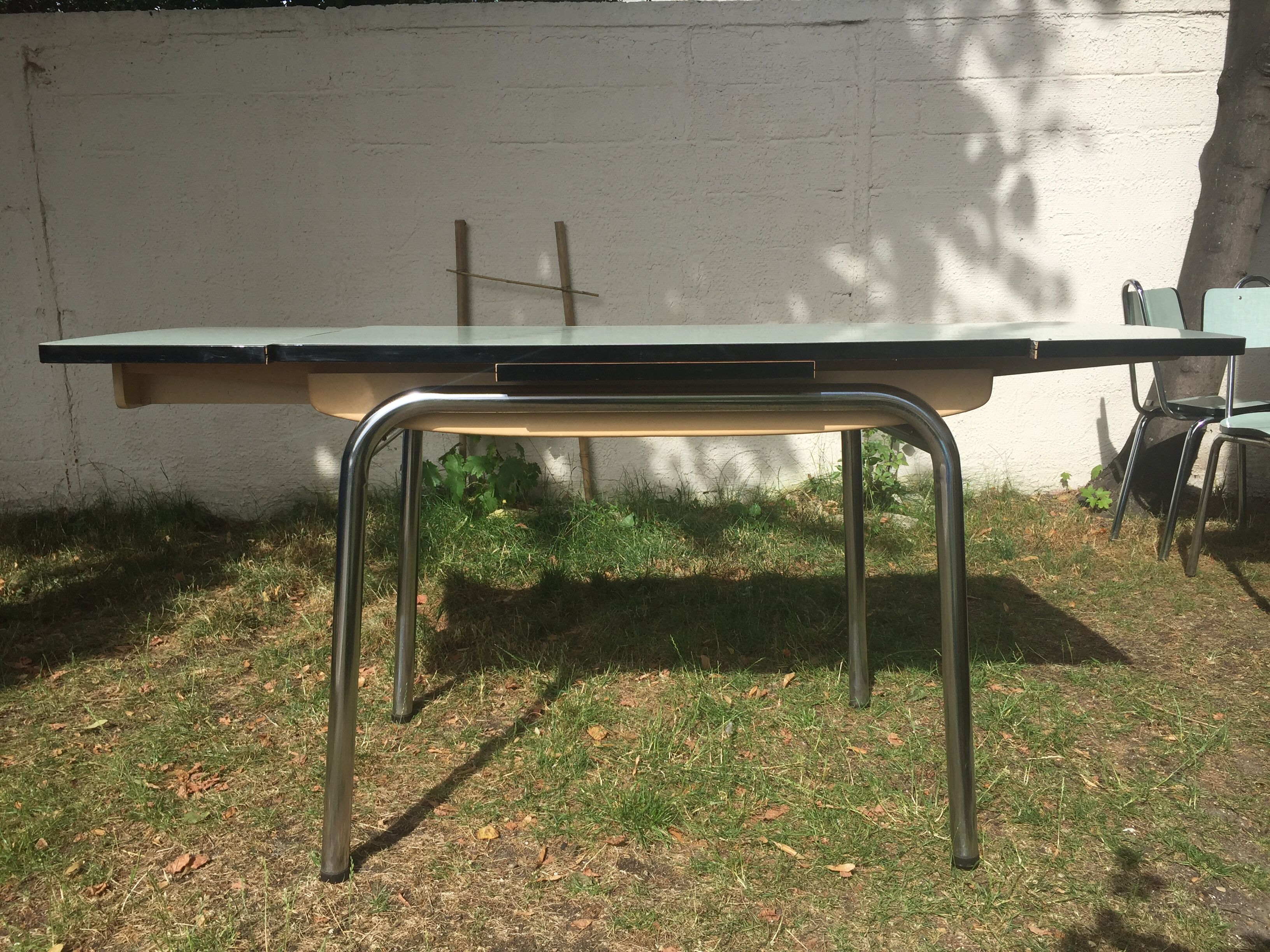 Table and 4 green water formica chairs 60's