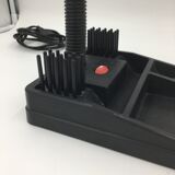 Duo of red and black flexible desk lamps with pencil holder