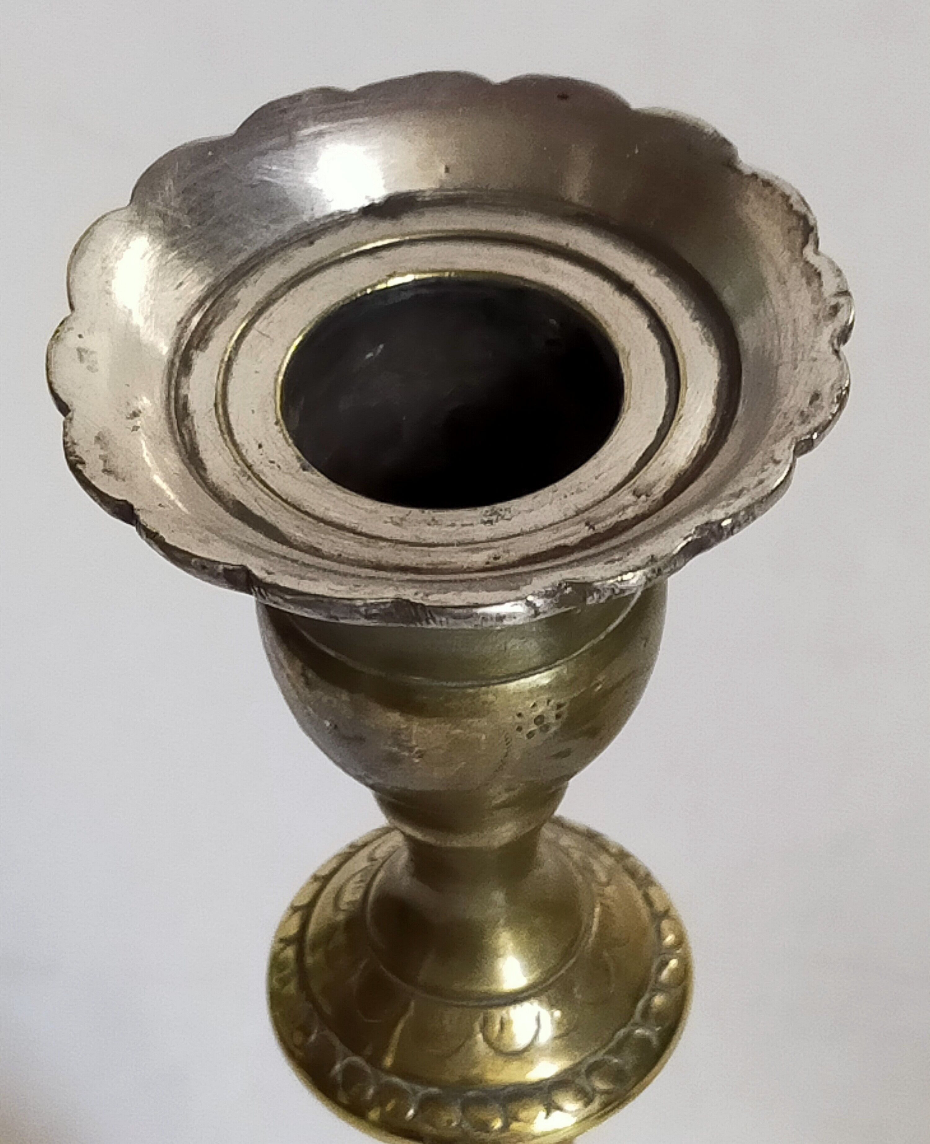 Duo of solid brass and gold metal candle holders worked old