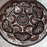 Oriental dish in chiseled red copper