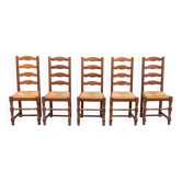 4 or 5 solid wood chairs with light oak straw and high backs