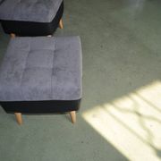 Set of 2 mid-century grey and black ottomans in fabric and eco-leather, wooden legs.
