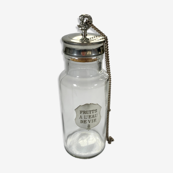 Old glass and openwork pewter jar for fruit with brandy