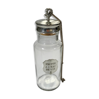 Old glass and openwork pewter jar for fruit with brandy