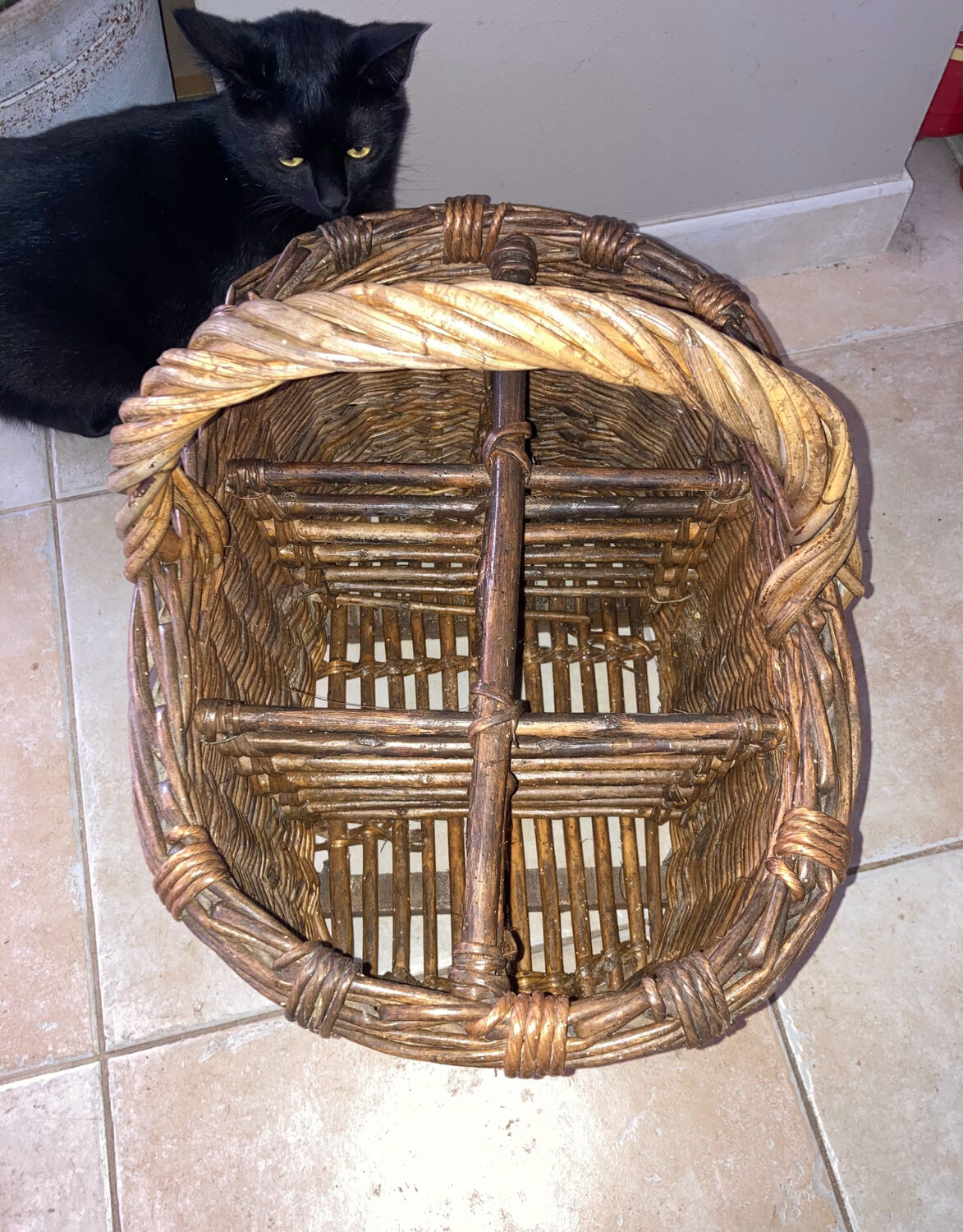 Wicker and hazel bottle basket from the early 20th century or possibly earlier.