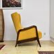 Yellow boucle wingback chair with folding footstool, 1950s