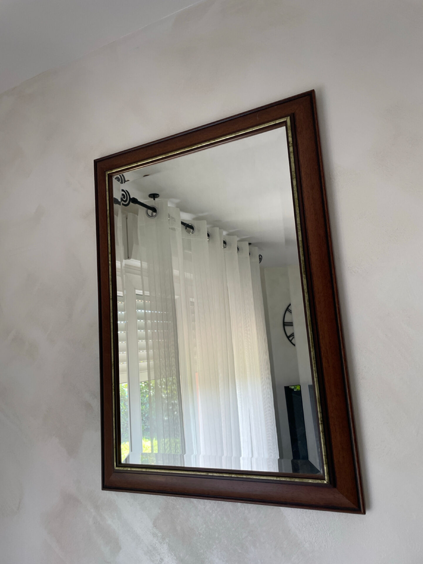 Vintage bevelled wall mirror in stained wood and brass