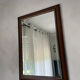 Vintage bevelled wall mirror in stained wood and brass