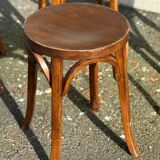 Set of four curved wooden stools stamped Baumann model 92.