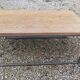 Solid wood living room coffee table with patinated metal legs