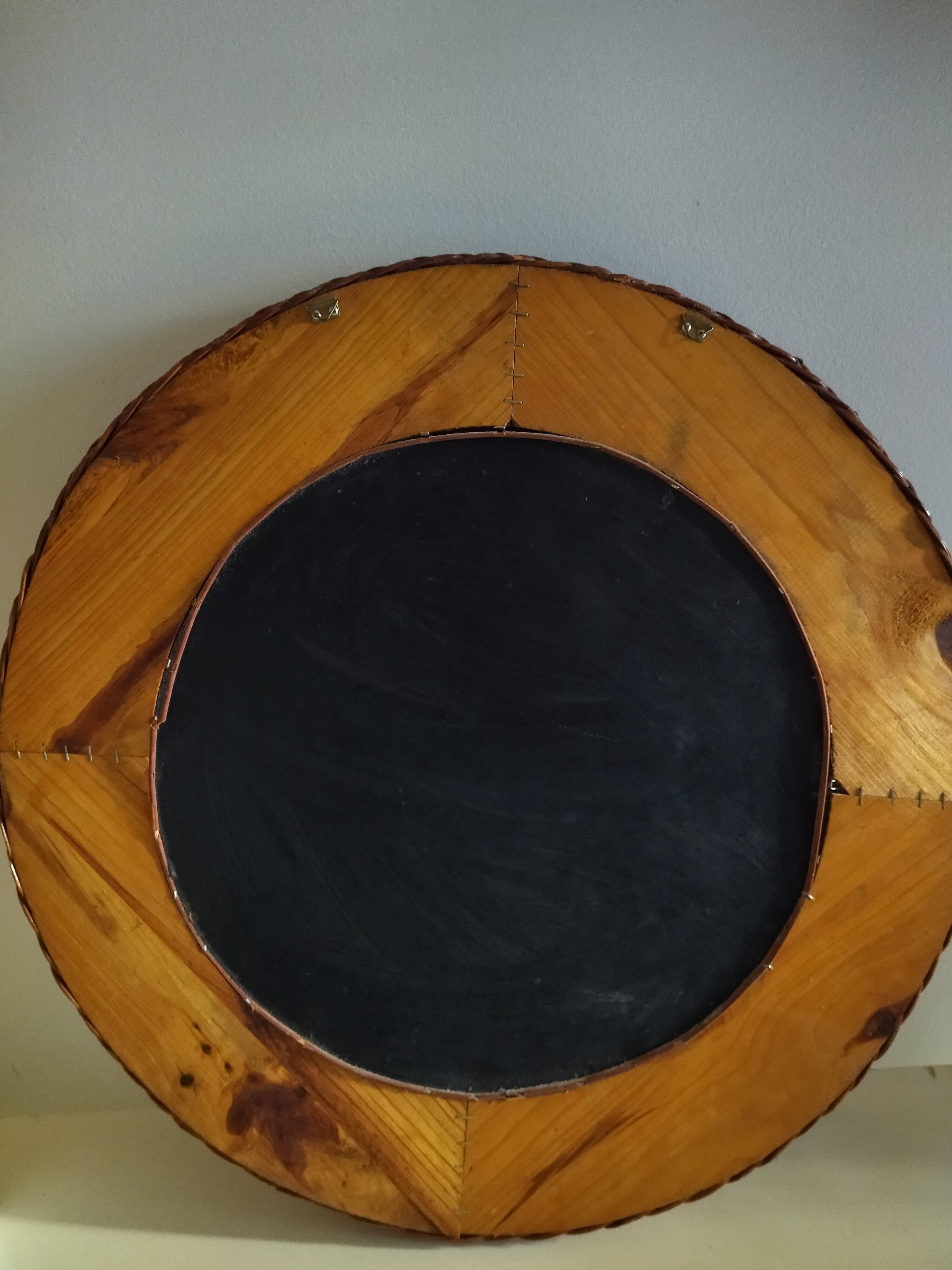 Round mirror, dark rattan