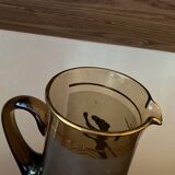 Vintage smoked glass carafe with gold from the 50s/60s, featuring a marine and water skiing design.