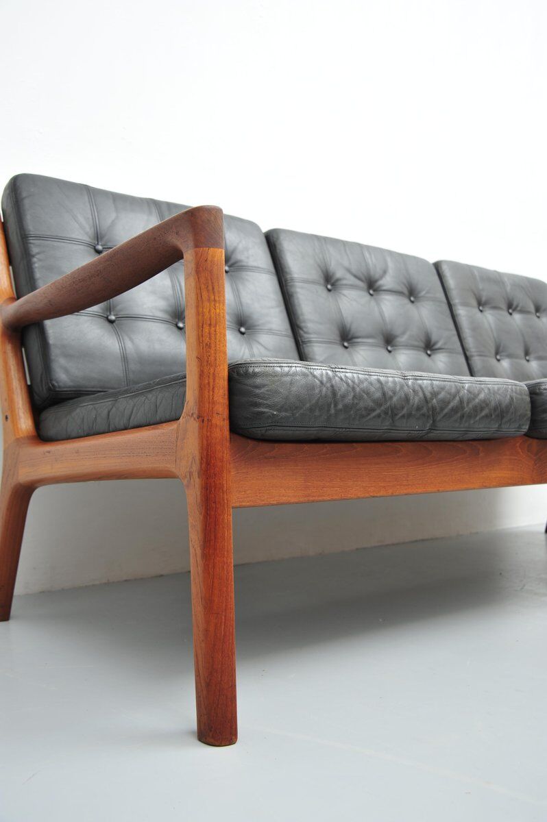 Senator sofa with black leather cushions by Ole Wascher for France and Son