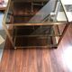 Vintage brass serving trolley with smoked glass trays.