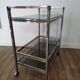 Stainless steel bar and smoked glass serving table