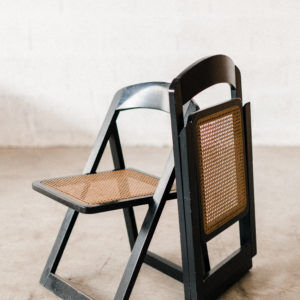 Folding black cannage chair