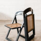 Folding black cannage chair