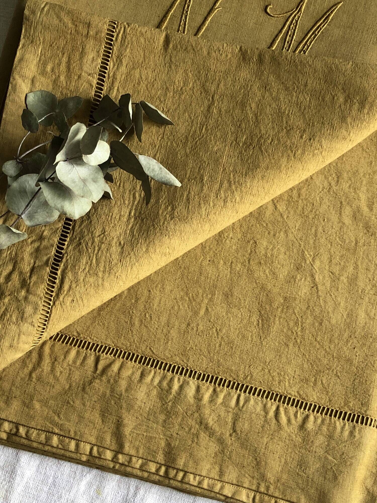 Old linen and cotton sheet embroidered and tinted in Indian yellow