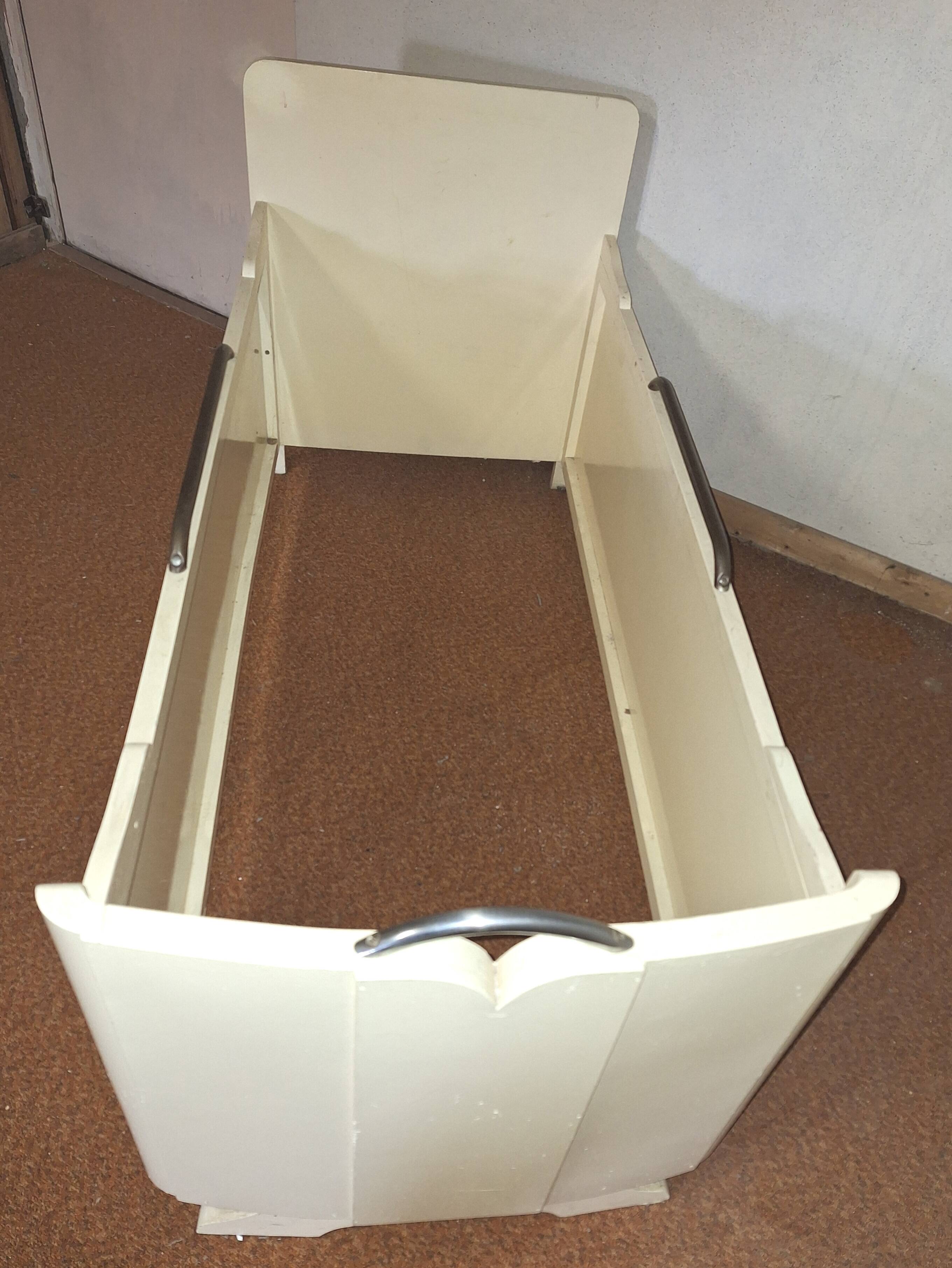 Painted wooden child's bed.