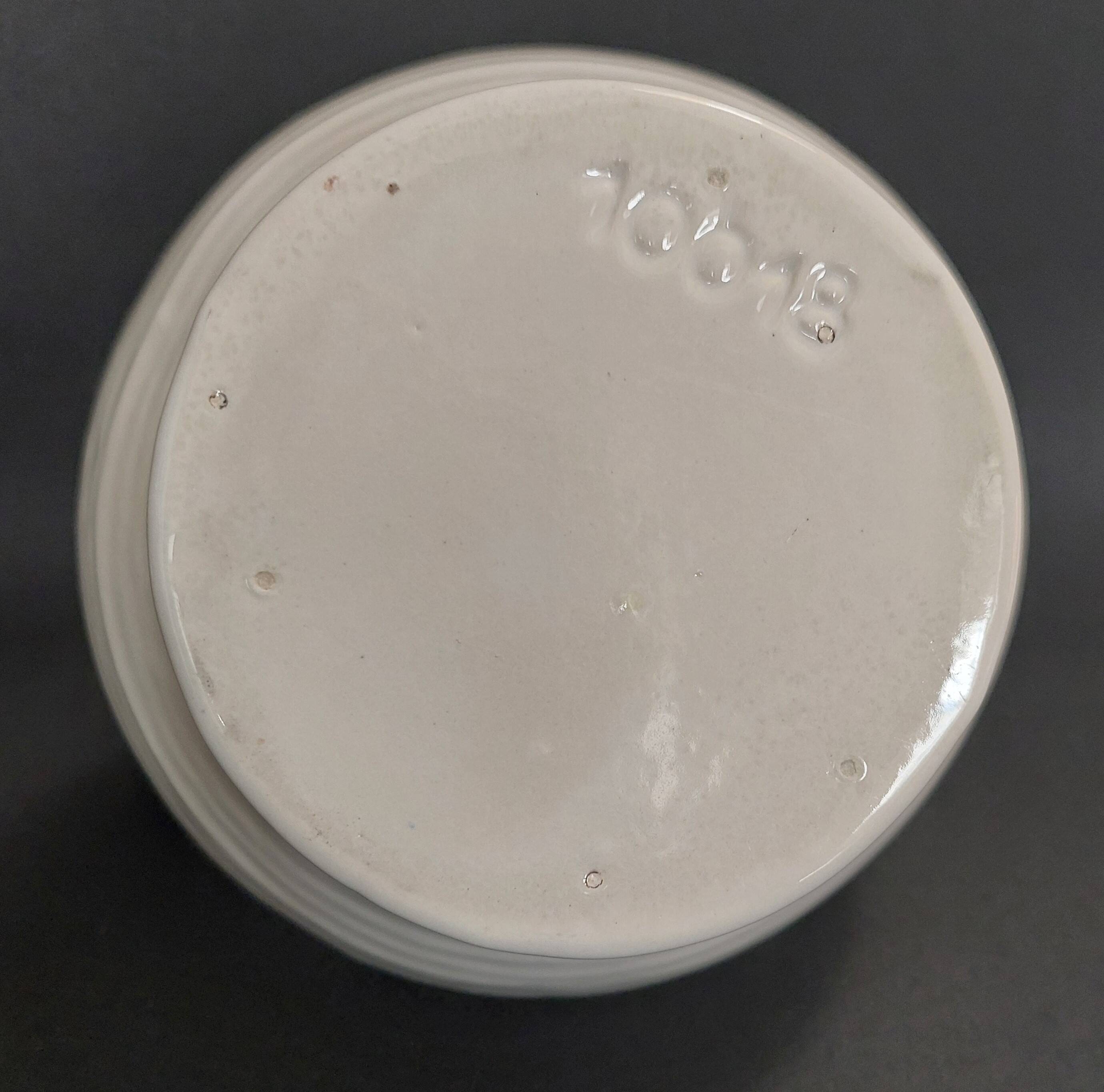 White ceramic goat-shaped creamer, first half of the 20th century.