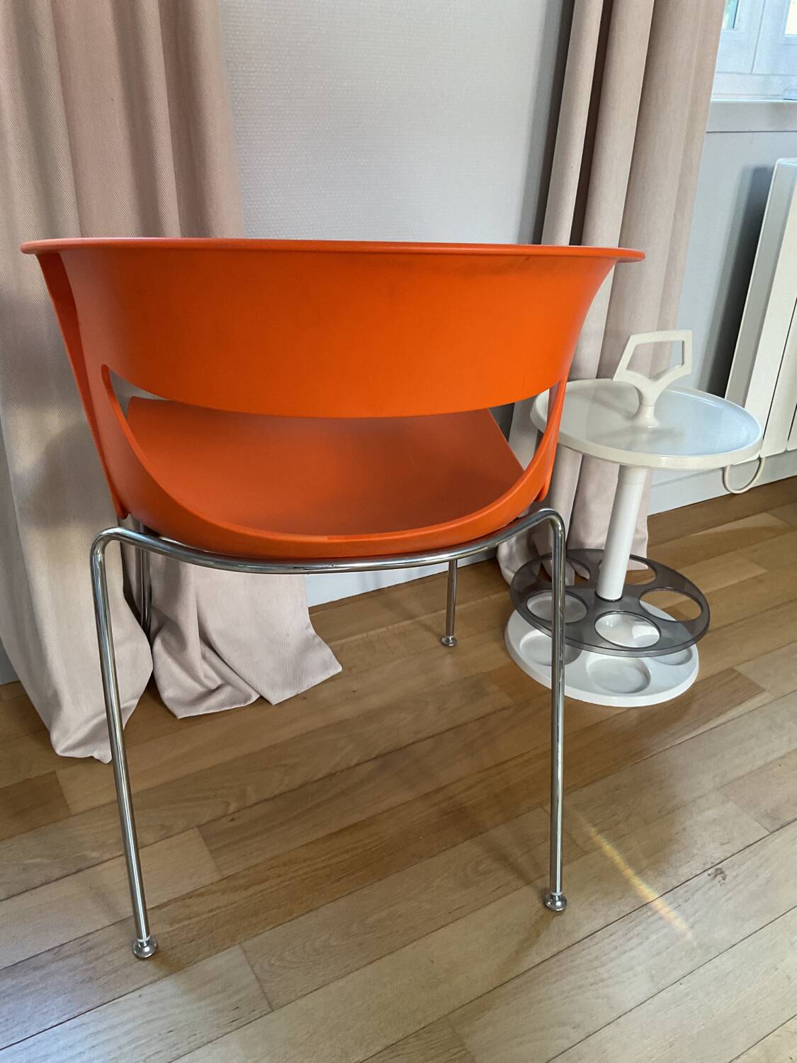 Two orange kicca chairs made in italy tbe