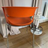 Two orange kicca chairs made in italy tbe