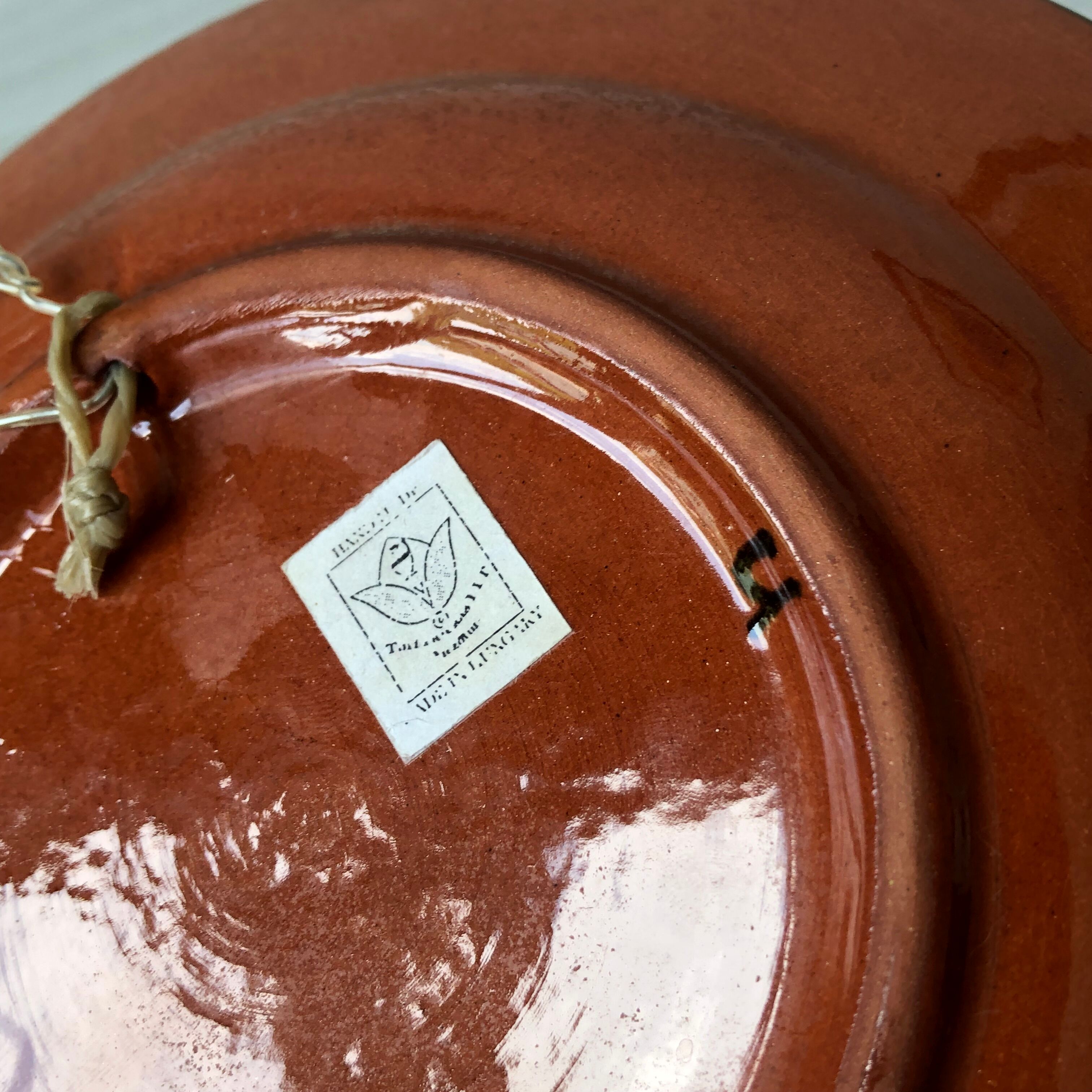 Very decorative serving plate in terracotta, floral and geometric motifs.