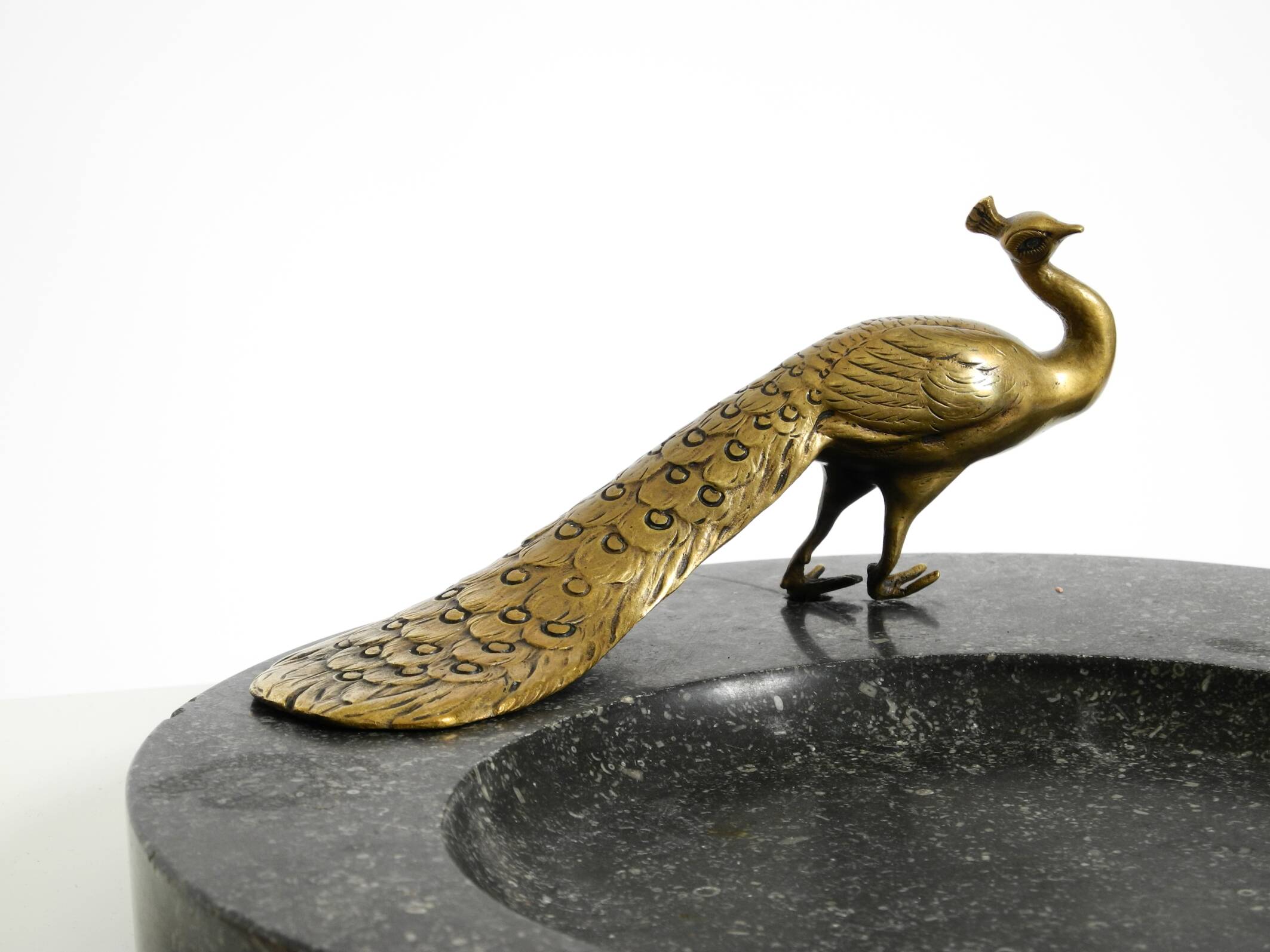 Beautiful, large black granite valet tray featuring a brass peacock, circa