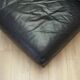Black leather pouffe/armchair, Italian design, 1960s, production: Italy