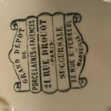 Old earthenware dish on foot