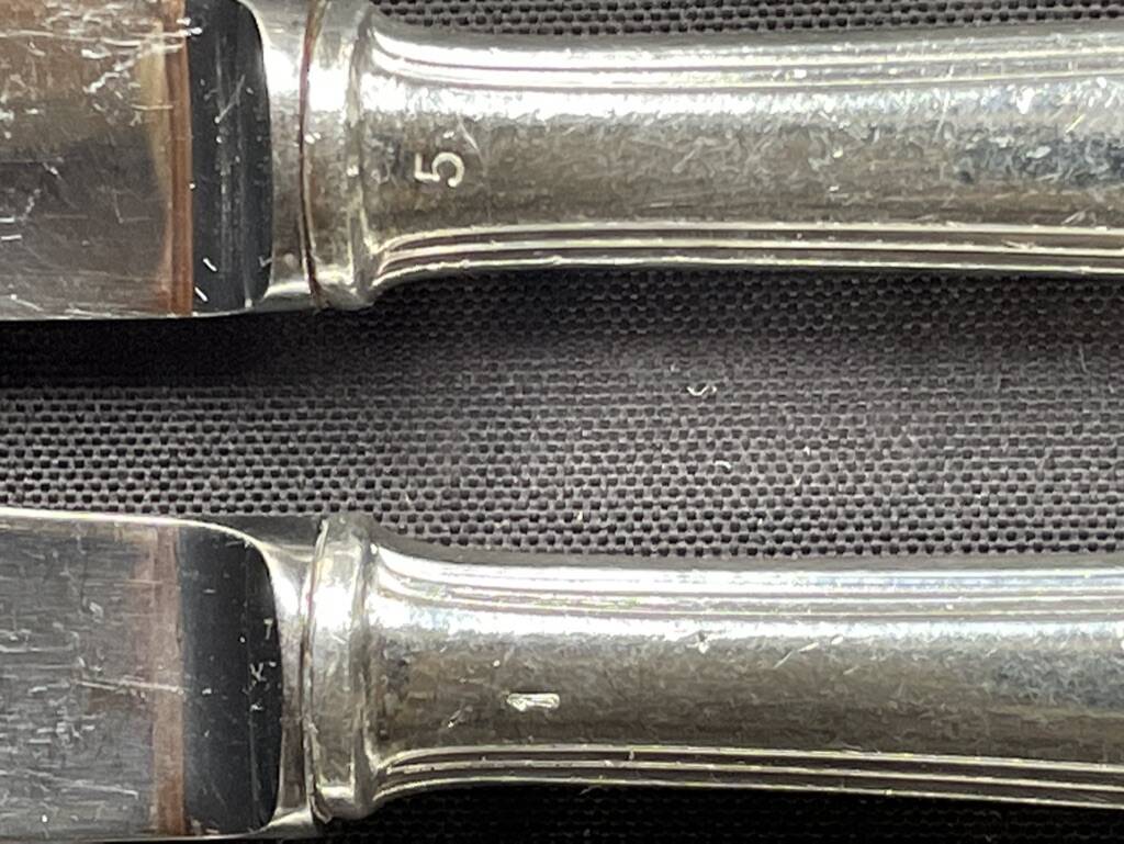 6 George V numbered knives including 3 Christofle